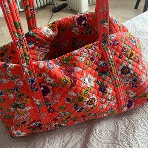 Vera Bradley duffle bag ( coral color) 27 inches across.